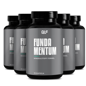 Fünf schwarze Dosen mit der Aufschrift 5er Fundamentum und dem QLF-Branding, die jeweils 90 Kapseln enthalten, sind in einer versetzten Reihe angeordnet. Diese wissenschaftlich basierte Nahrungsergänzung unterstützt Ihre Gesundheit optimal.