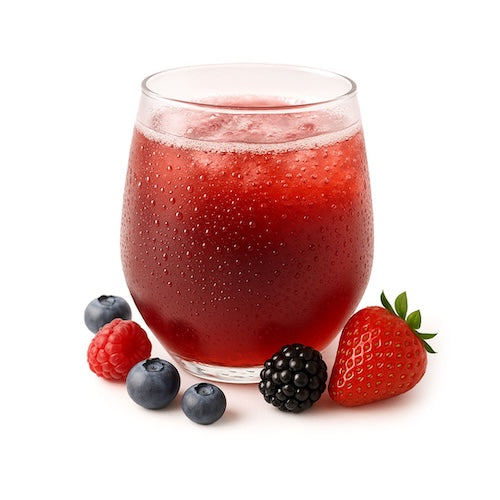 Chilled glass of red berry drink with fresh strawberry, blackberry, raspberry, and blueberries on white surface