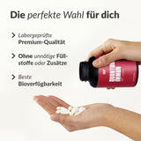 Quantum Immun Hand zeigt geöffnete Flasche mit Kapseln, Fokus auf Laborqualität und beste Bioverfügbarkeit, Galerieposition 1