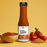Tasty Sauce Curry Ketchup mit 4 Kalorien, daneben Tomaten und Curry Gewürz, präsentiert von Quantum Leap Fitness