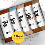 Tasty Bar Proteinriegel Probierbox mit fünf verschiedenen Sorten, elegant verpackt und übersichtlich präsentiert.
